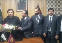 Newly elected Secretary Finance of Rawalpindi District Bar Association Rawalpindi Uzma Mubarak and her brother presented bouquet to President District Bar Rawalpindi Faisal Niazi.