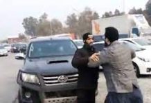 VIDEO: PTI’s Farrukh Habib tries to stop police van taking Fawad Chauhdry to Islamabad