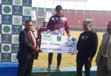 Islamabad (TNS) Asghar Ali Mubarak and Shahidul Haq presenting check to winner athlete during the prize distribution ceremony of Quaid-e-Azam Inter-Provincial Games Athletics events.